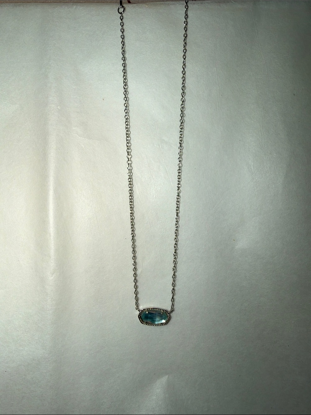 Kendra Scott Silver Necklace with Translucent Aqua Blue Oval Pendant